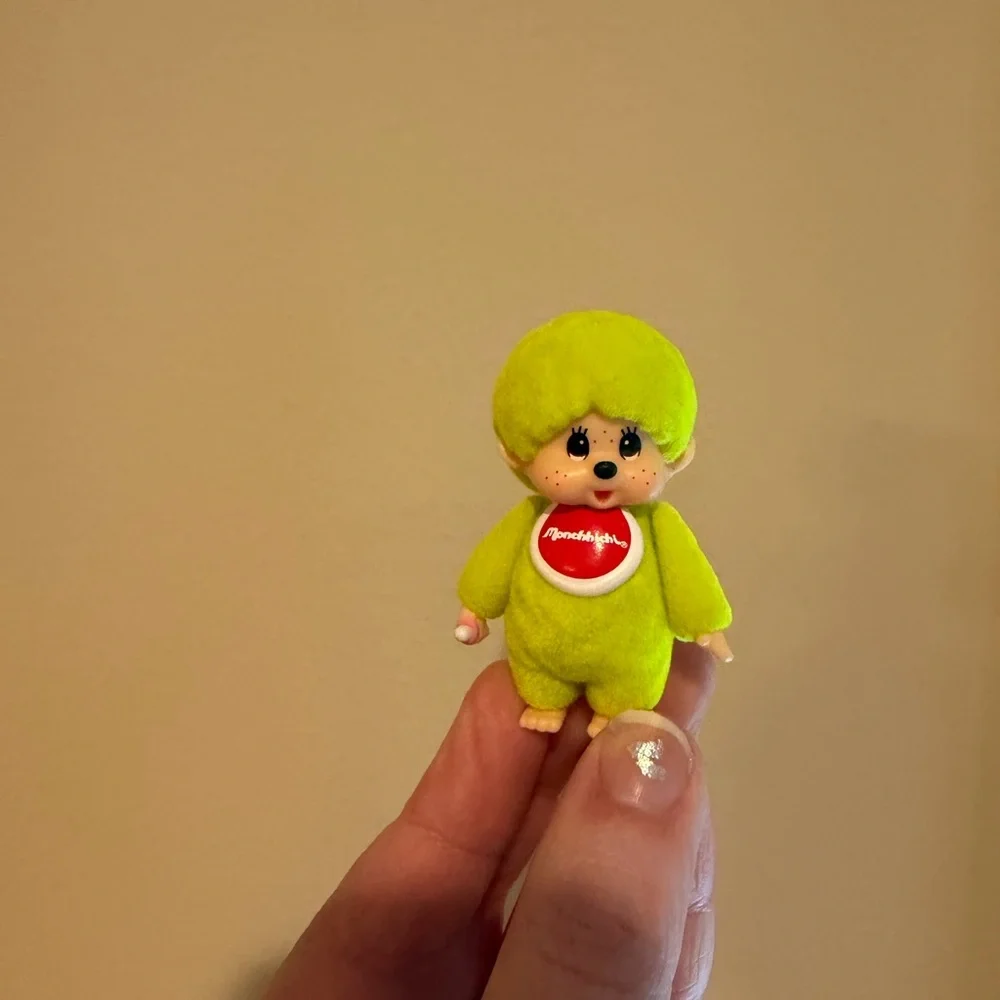 Neon yellow Monchhichi doll